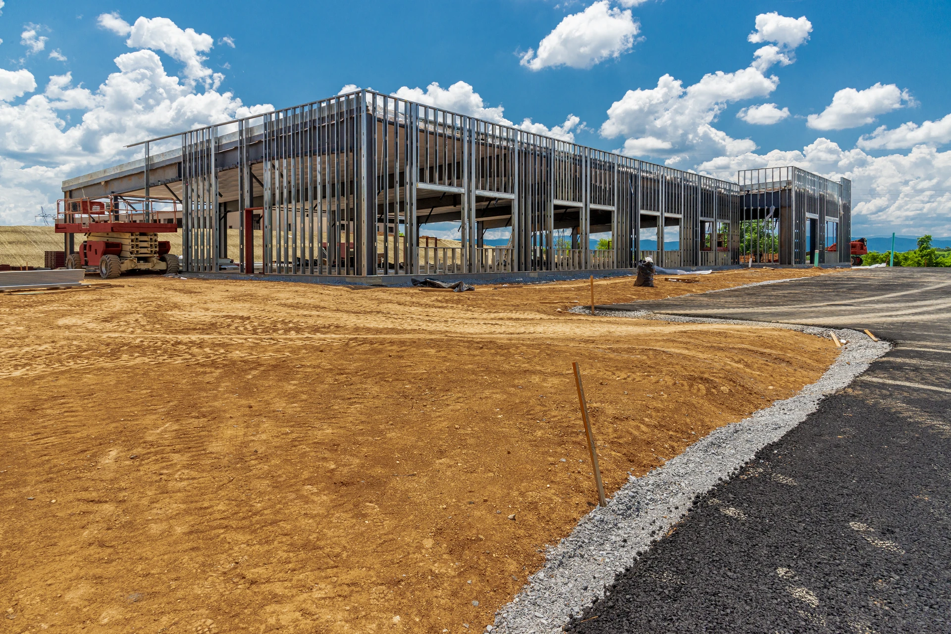 Steel wall framing around a commercial building under construction